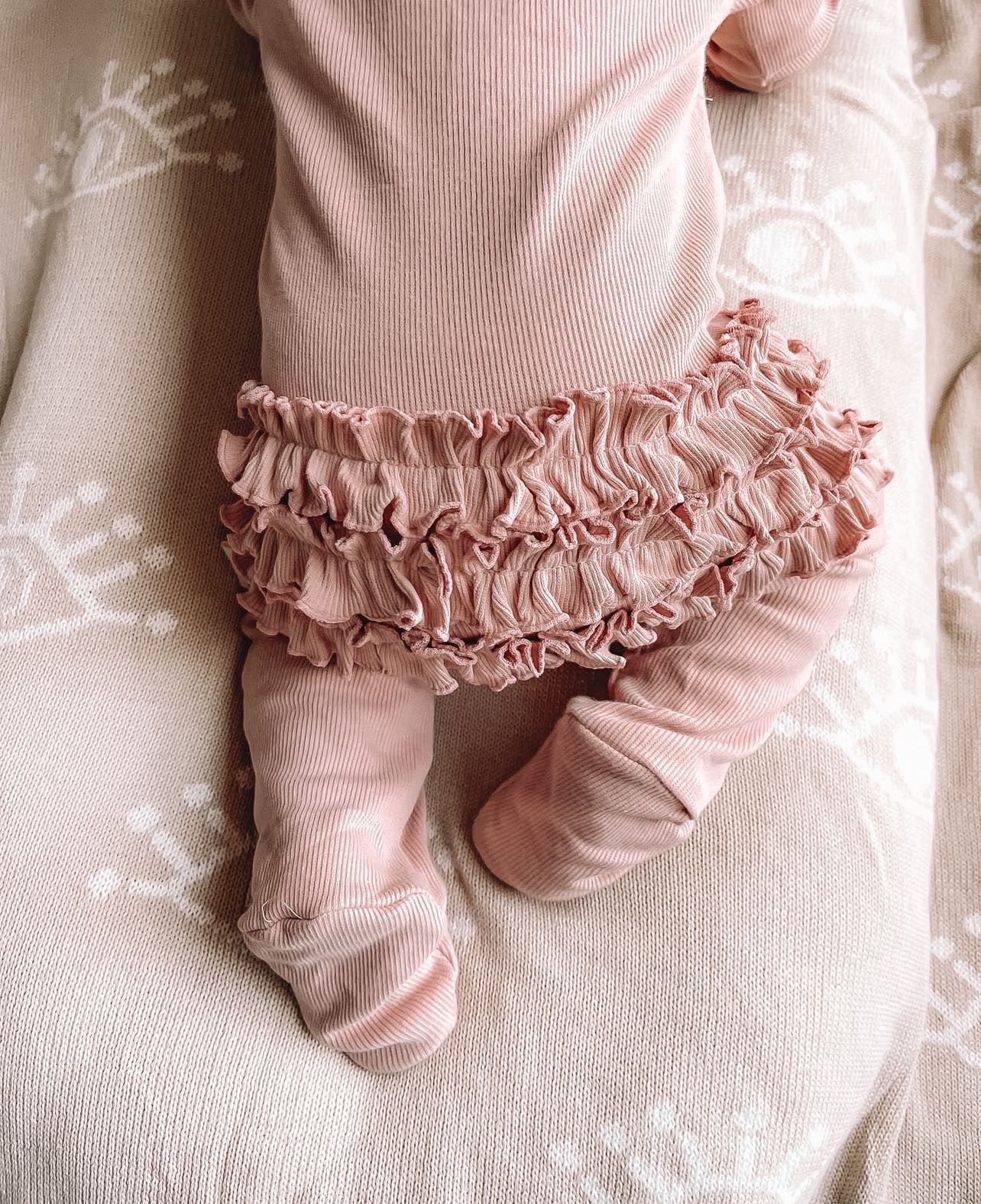 frilly pink onesie